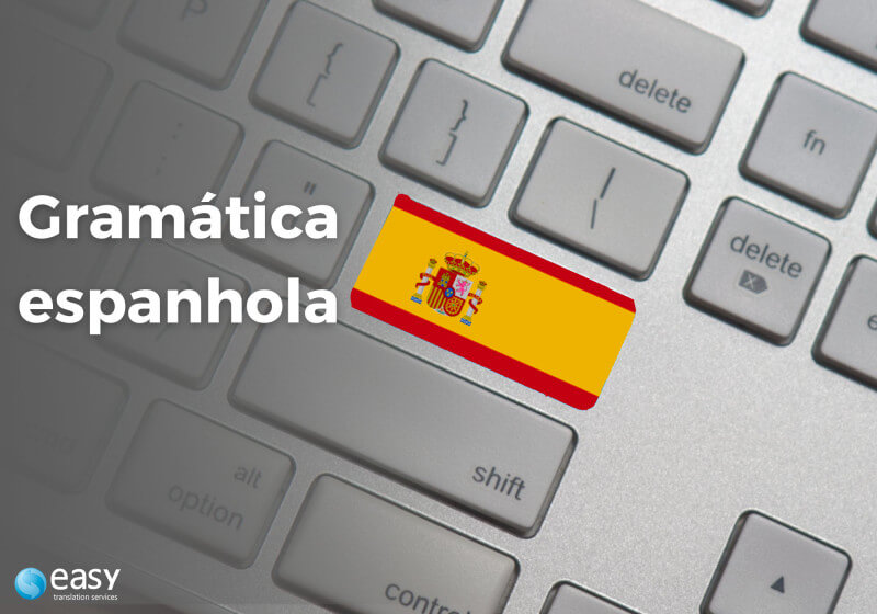 Imagem de um teclado com a tecla Enter com a bandeira da Espanha.